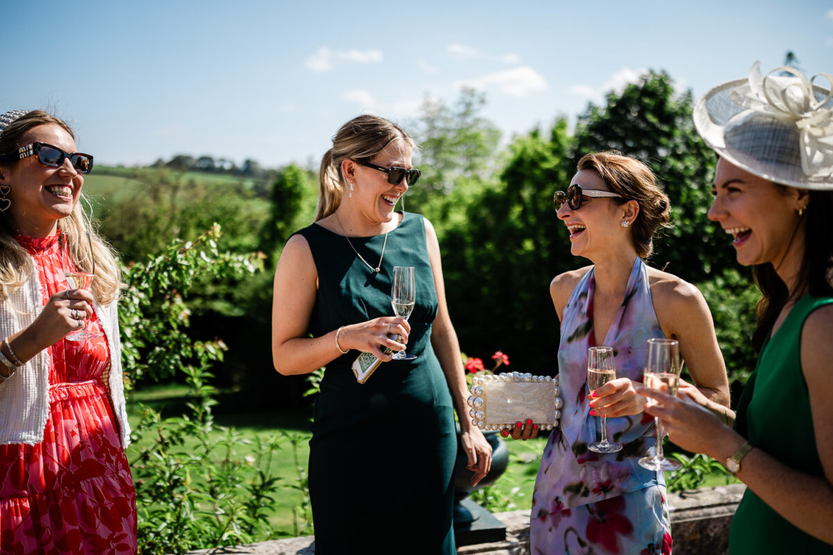 Outdoor wedding reception captured by wedding photographer at Pynes House