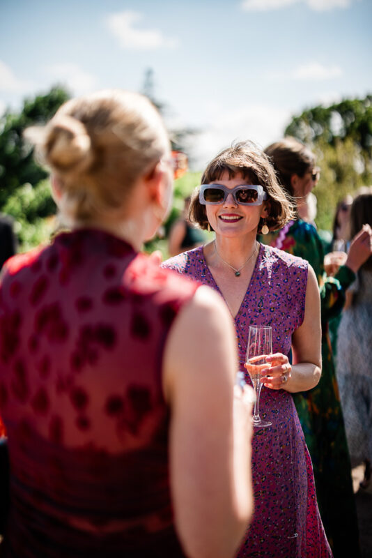 Outdoor wedding reception captured by wedding photographer at Pynes House